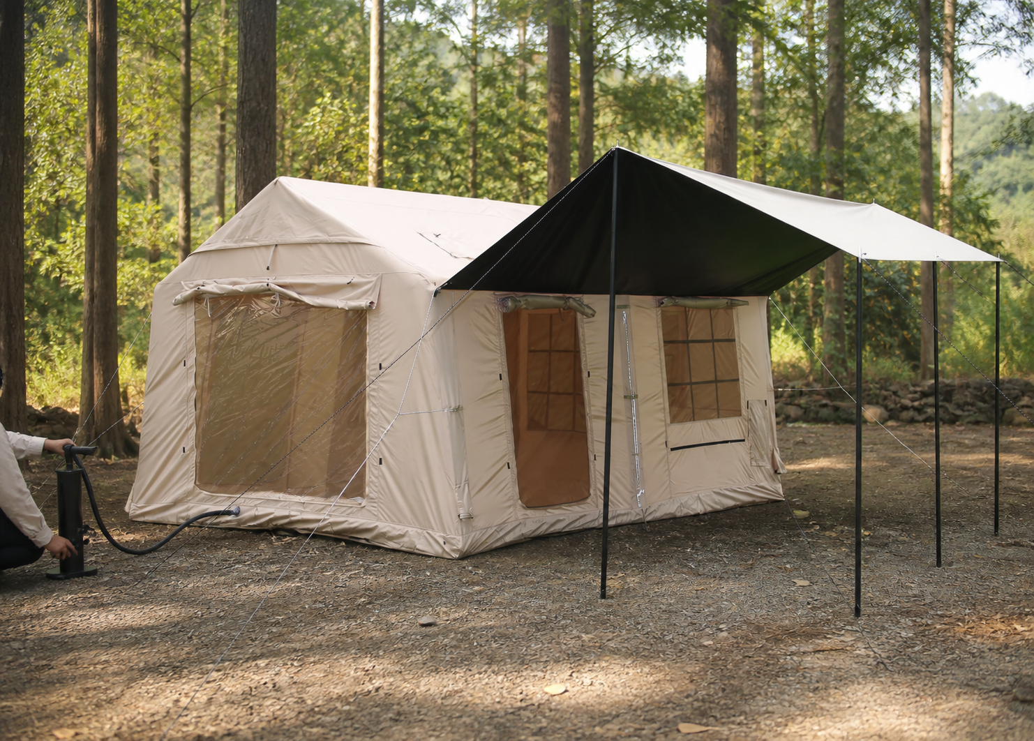 Hand pump connected while pitching the three-door partitioned tent