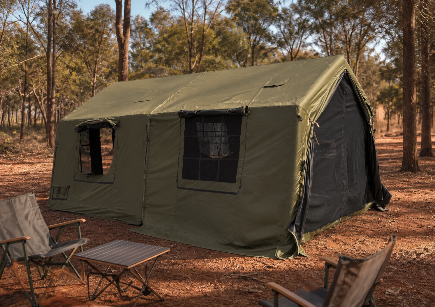 Green expandable polycotton tent in a hillside campsite setting